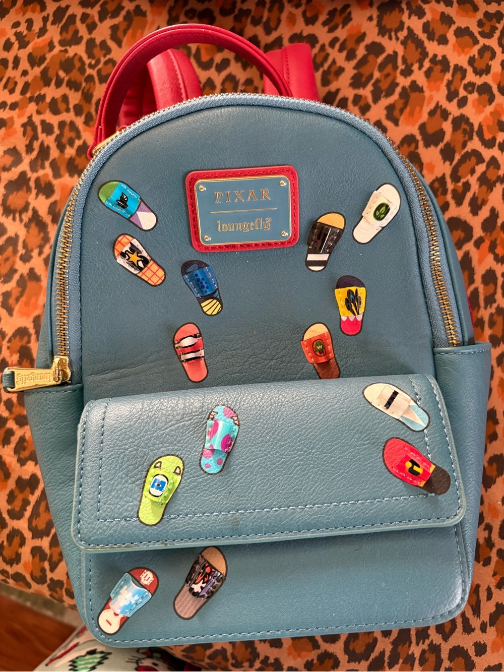 Loungefly Pixar Blue Kids Mini Backpack with Colorful Flip-Flop Charms